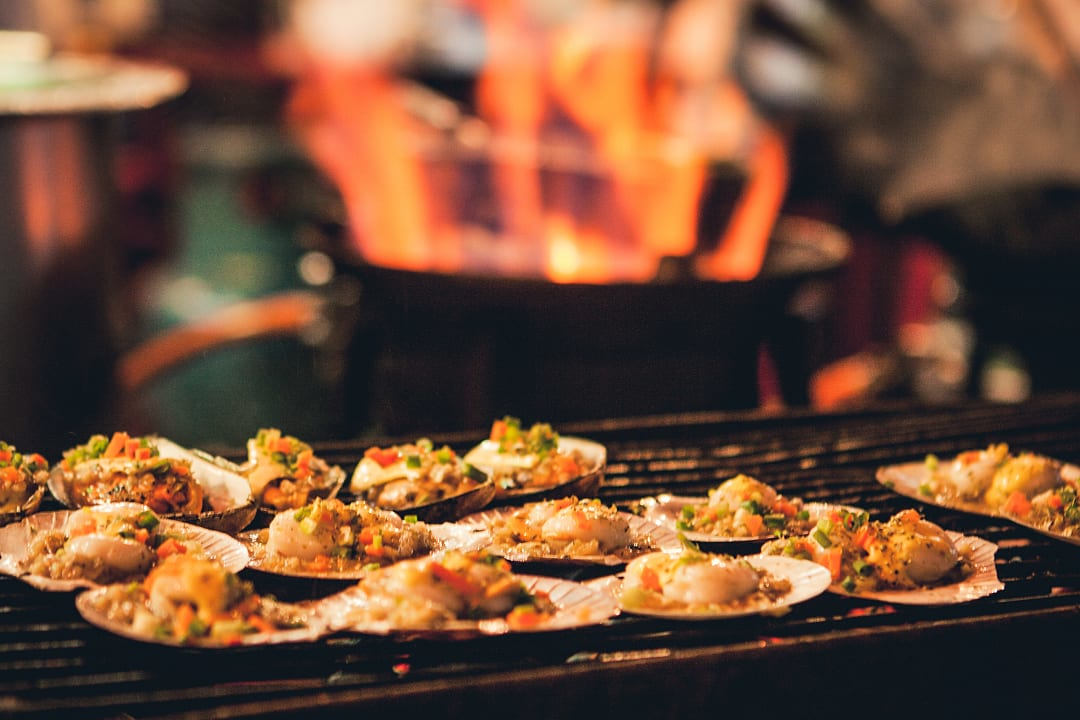 Grilled scallops served at a restaurant in Bangkok, Thailand.