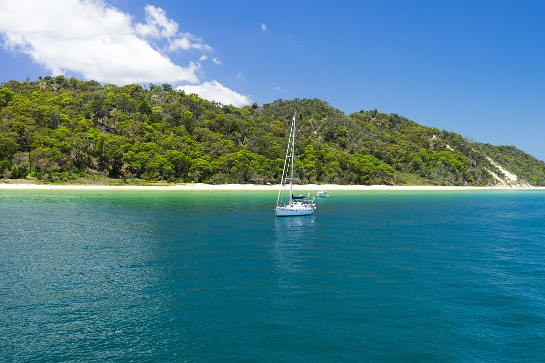 A private yacht charter in the serene waters of Moreton island, Australia.
