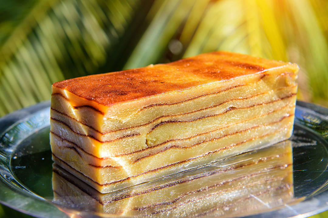 Coconut layer cakes paired with aged feni or vinho verde.