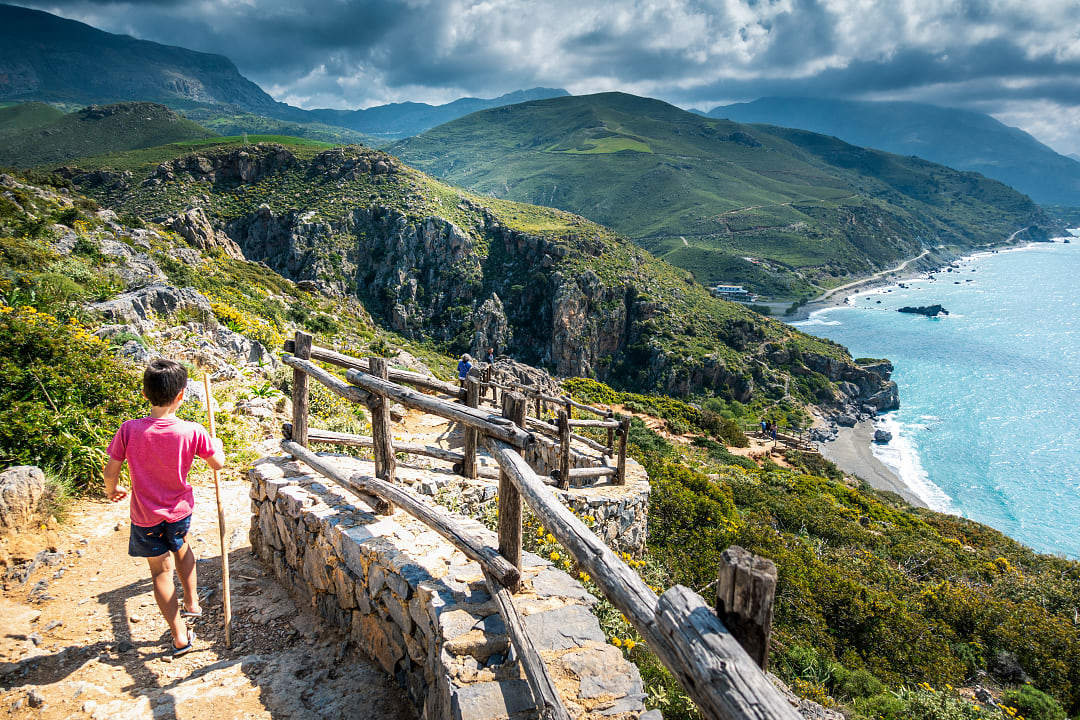 Child in Greece where mythology becomes a literal landscape to walk through.