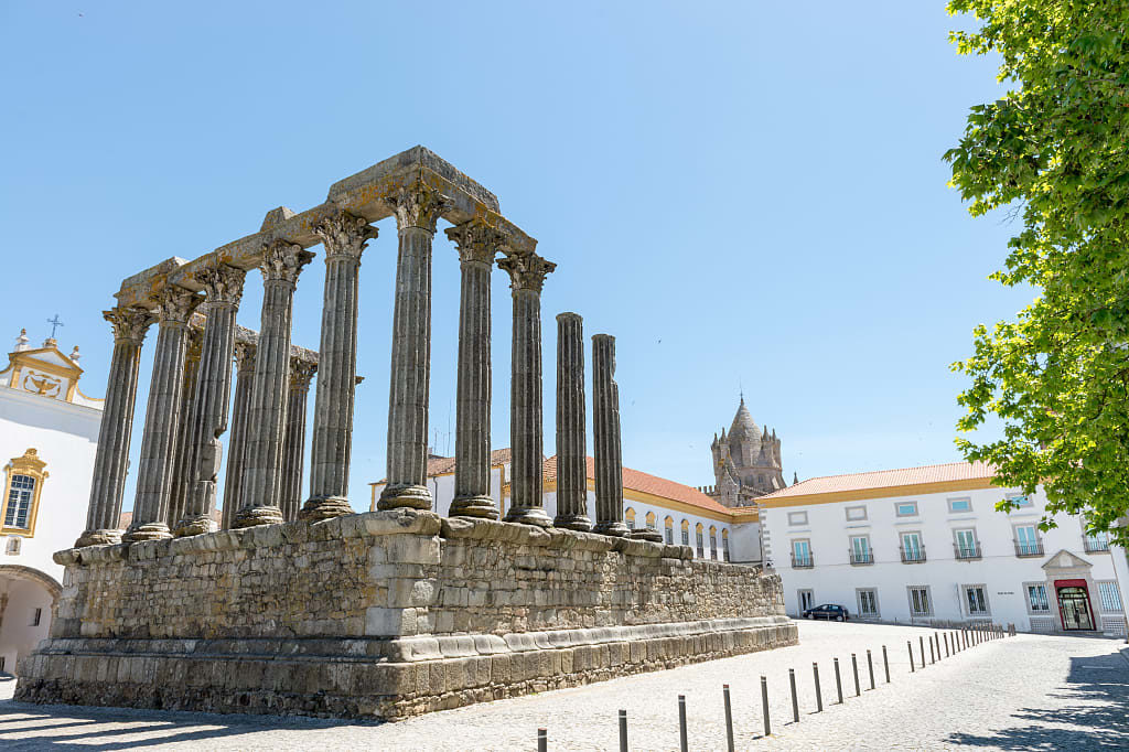 Ancient Roman temple and Cathedral tower in Evora, Portugal