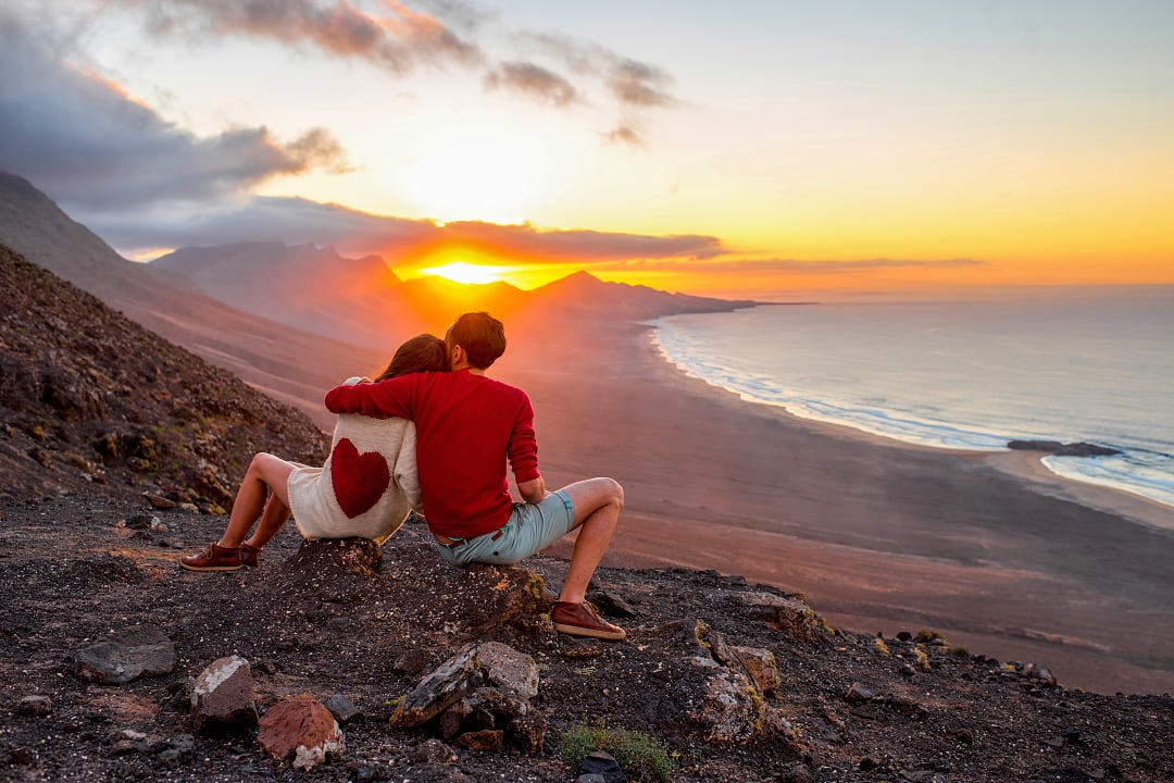 Couple watching the sunset in the Canary Islands, Spain