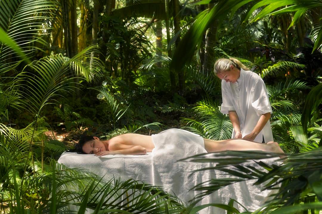 A woman enjoying a massage in the Whitsunday Islands.