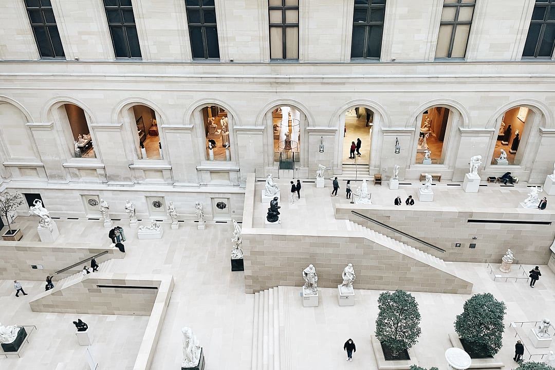 Tourists inside the The Louvre Museum in Paris