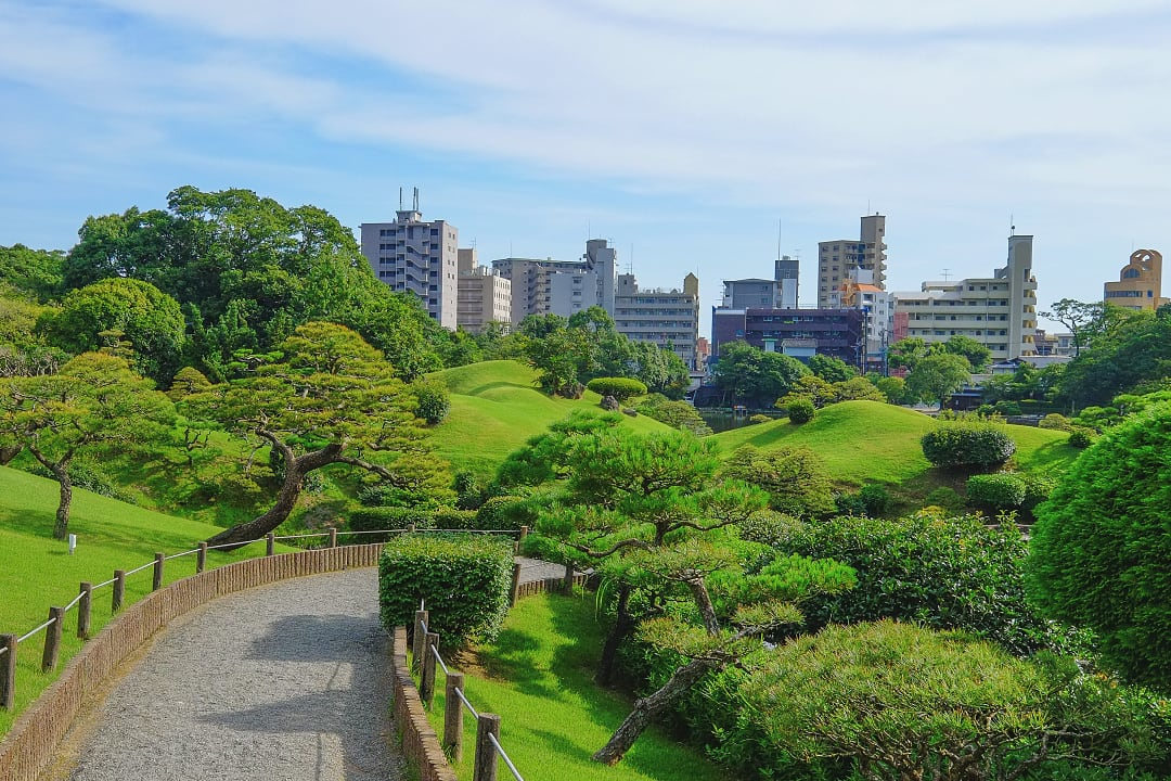Kumamoto Downtown skyline and traditional Japanese garden