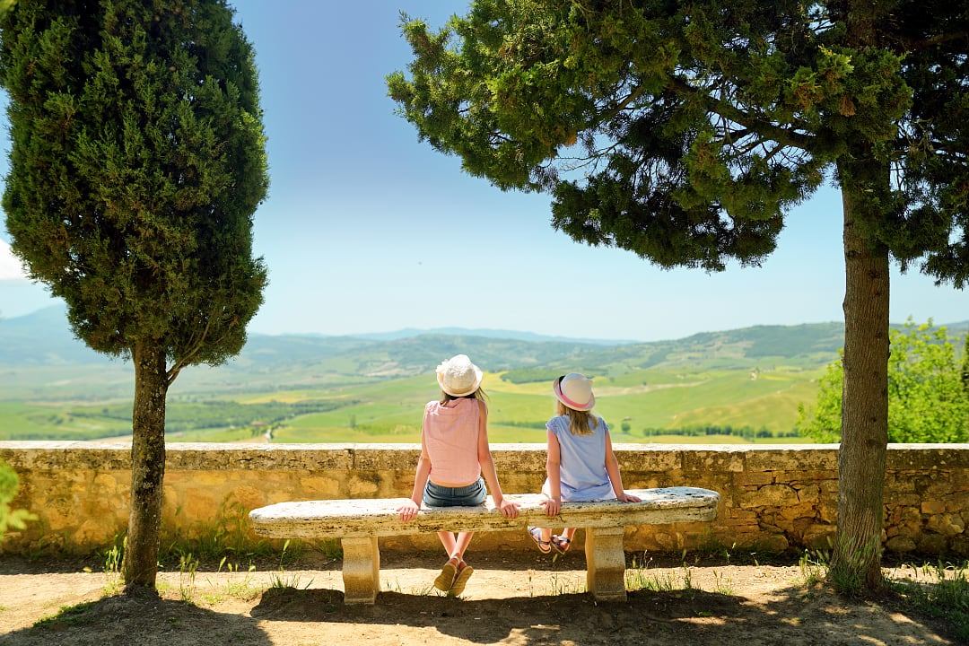 Children in Tuscany where history and daily life unfold like a stage set.