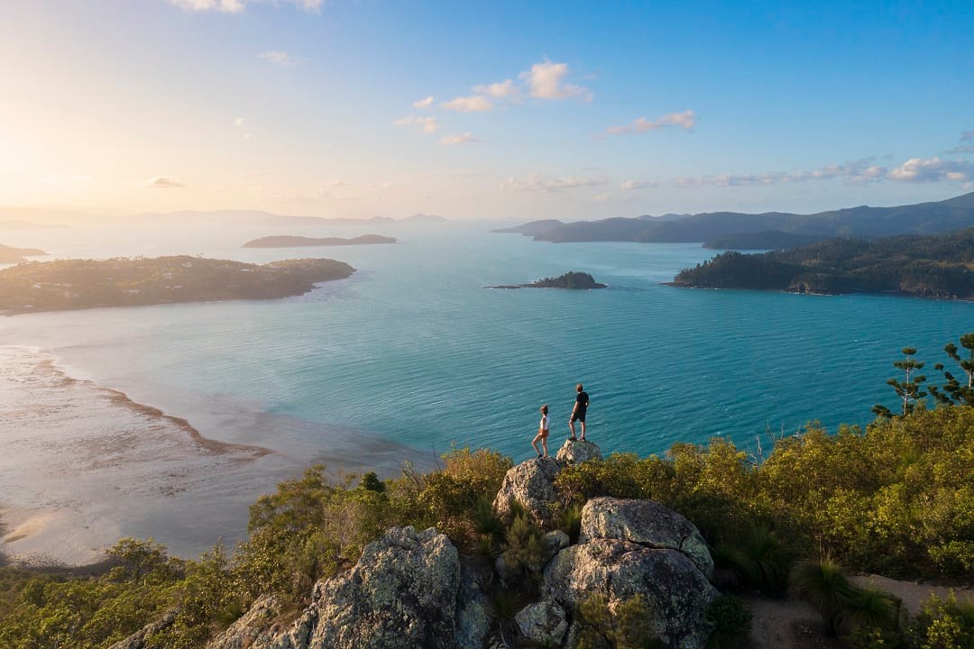 Hikers exploring the serene Whitsunday Island.