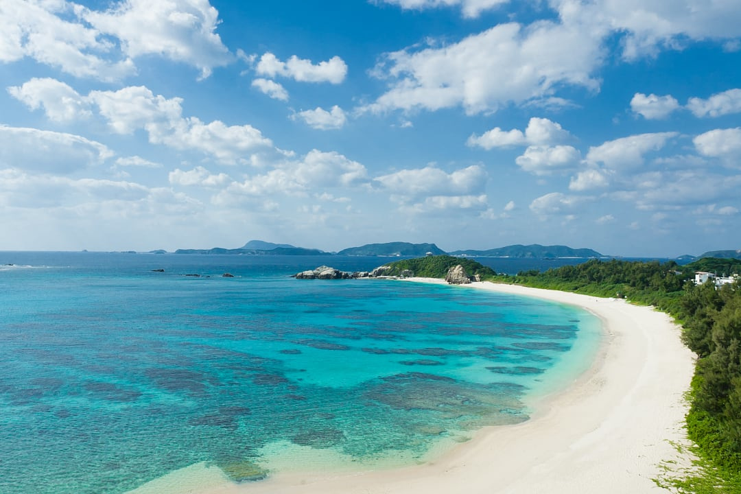 Stretch of white sand and clear turquoise water at Aharen Beach in Okinawa beach in April