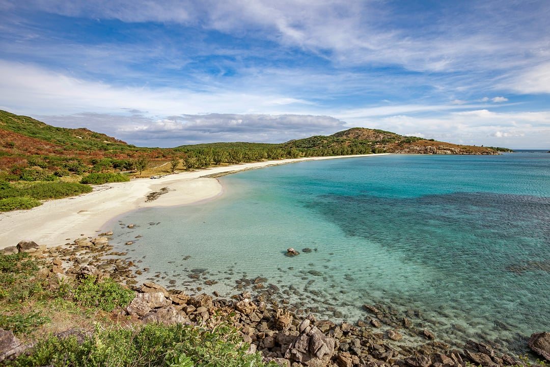 Secluded white-sand beach on Lizard Island where luxury means the absence of others.