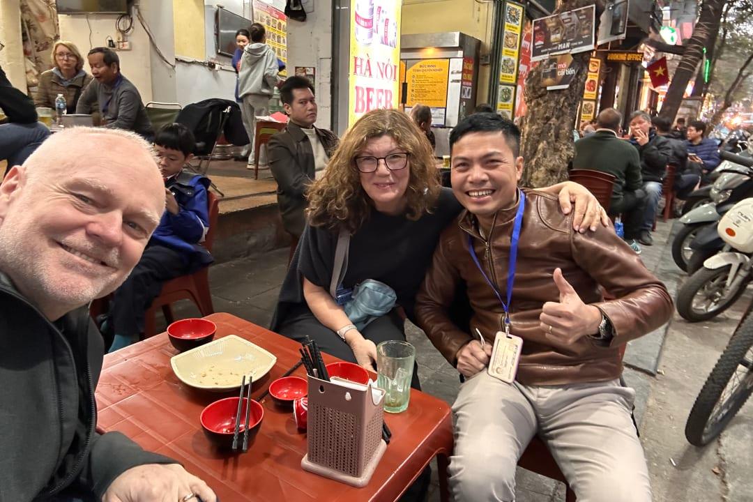 Enjoying street food with a local guide in Hanoi’s Old Quarter, Vietnam