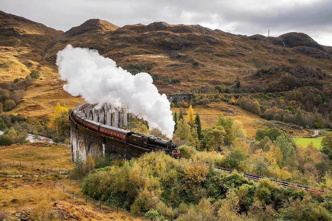 The Jacobite Steam Train moving through the landscapes of Scotland.