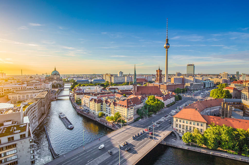 Aerial view of Berlin with the famous TV tower and Spree river at sunset