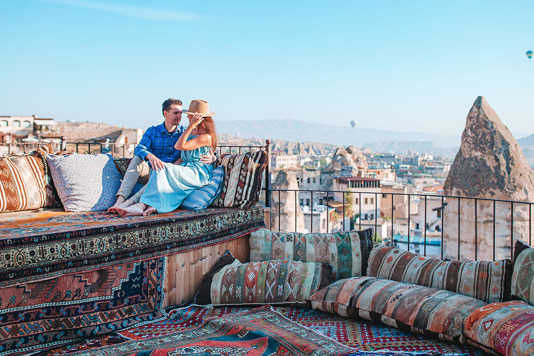 Couple in Cappadocia at sunrise in Turkey.