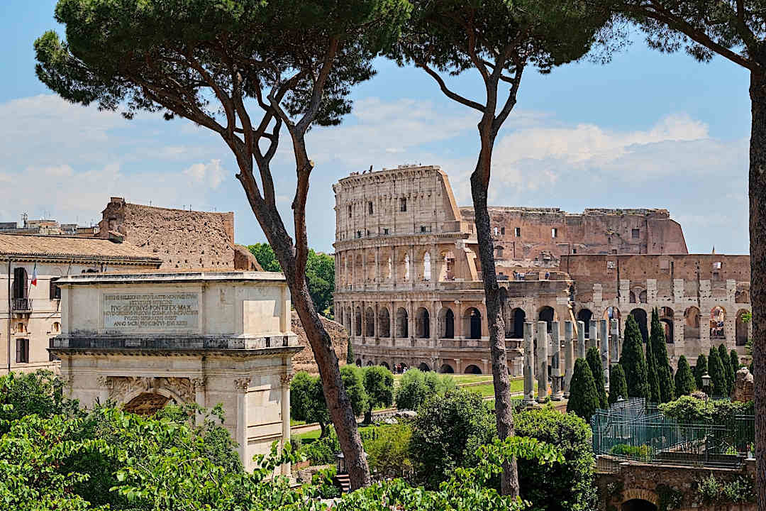 View of the Colosseum and the Arch of Titus, Rome.