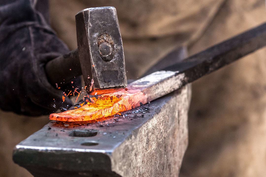 Blacksmith forging a sword