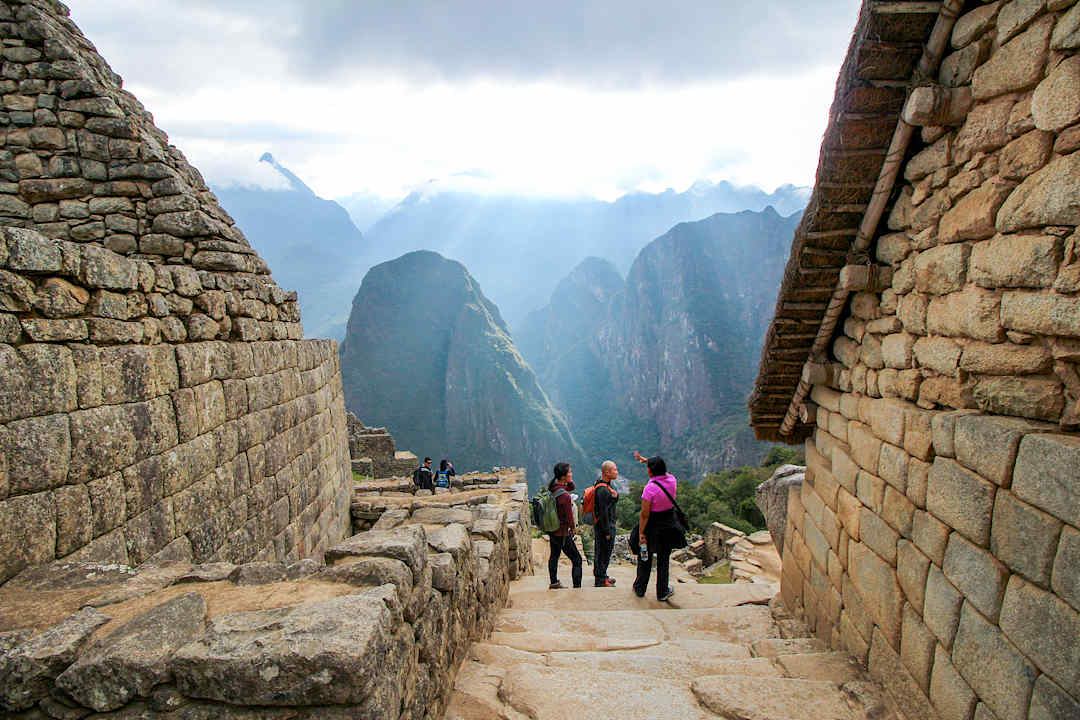 People admiring the Machu Picchu view.