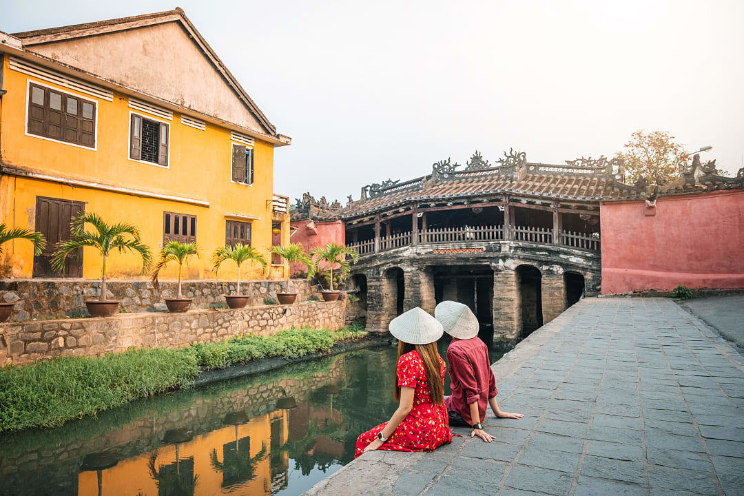 Couple at Japanese Covered Bridge in Hoi An in Vietnam