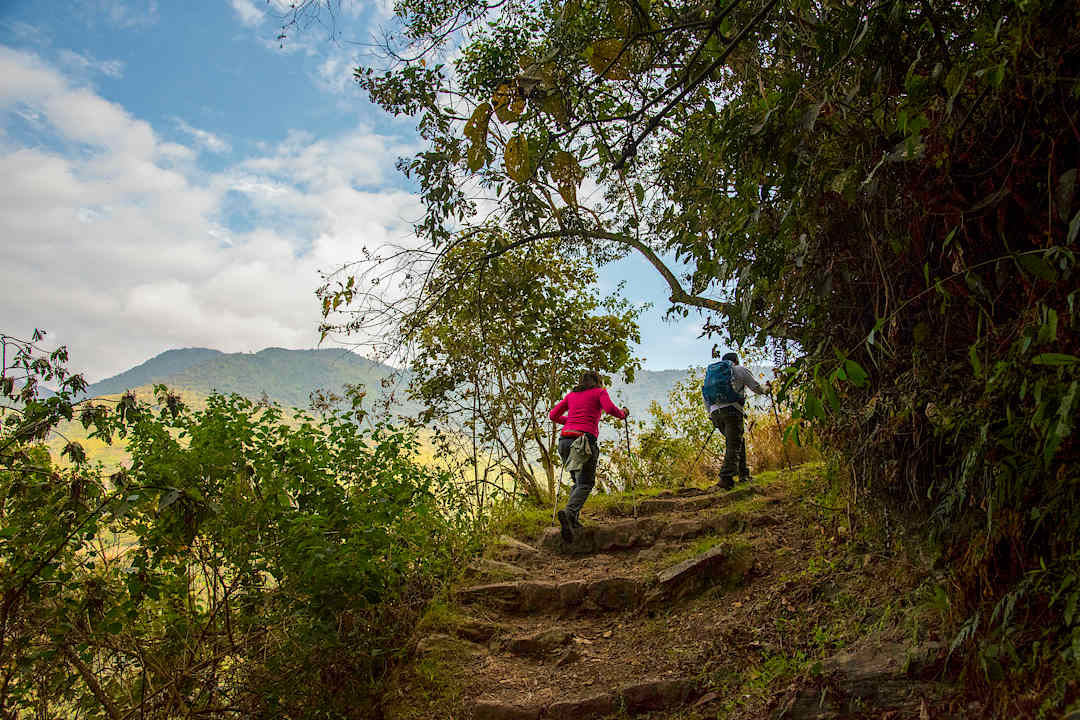 Couple hiking the Inca trail, Peru.