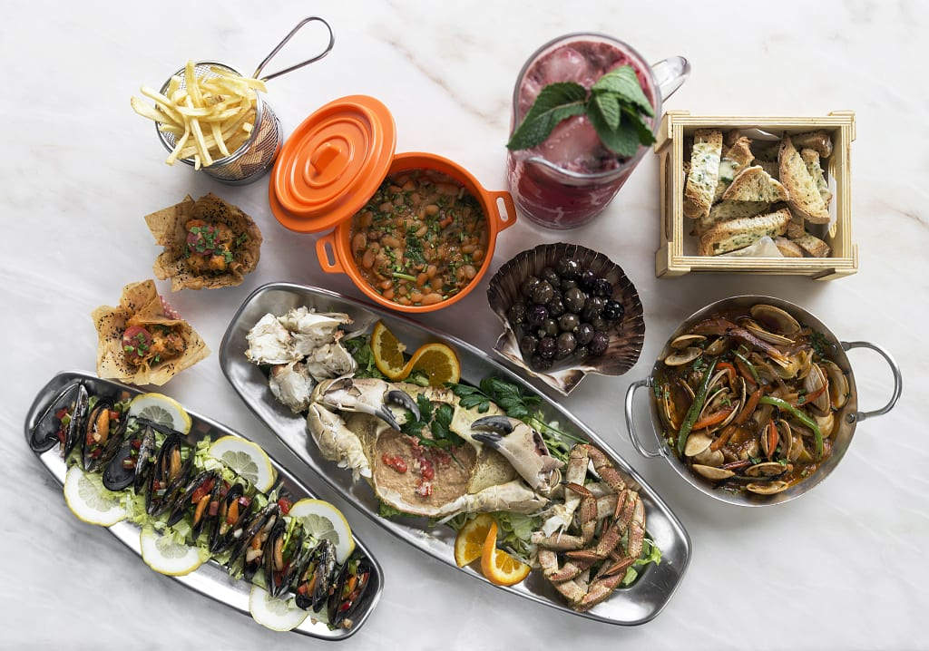 Mixed fresh Portuguese seafood selection at restaurant in Portugal
