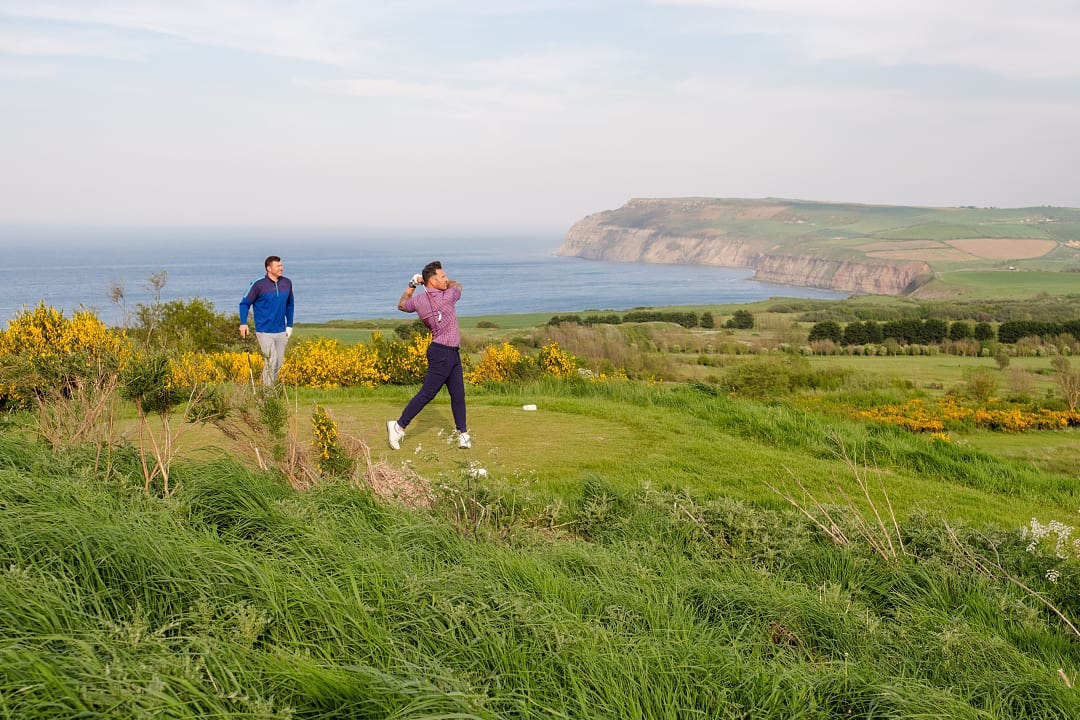 Two men golfing at Hunely Hall Golf Club in North Yorkshire, England