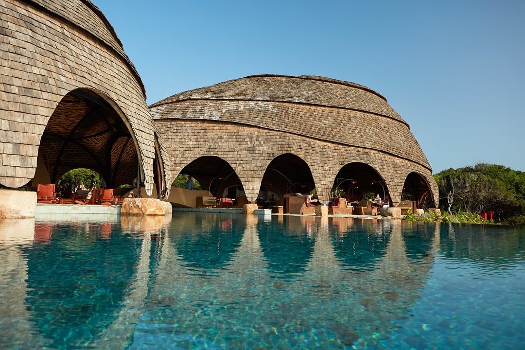 Infinity pool at Wild Coast Tented Lodge overlooking coastal jungle in Sri Lanka