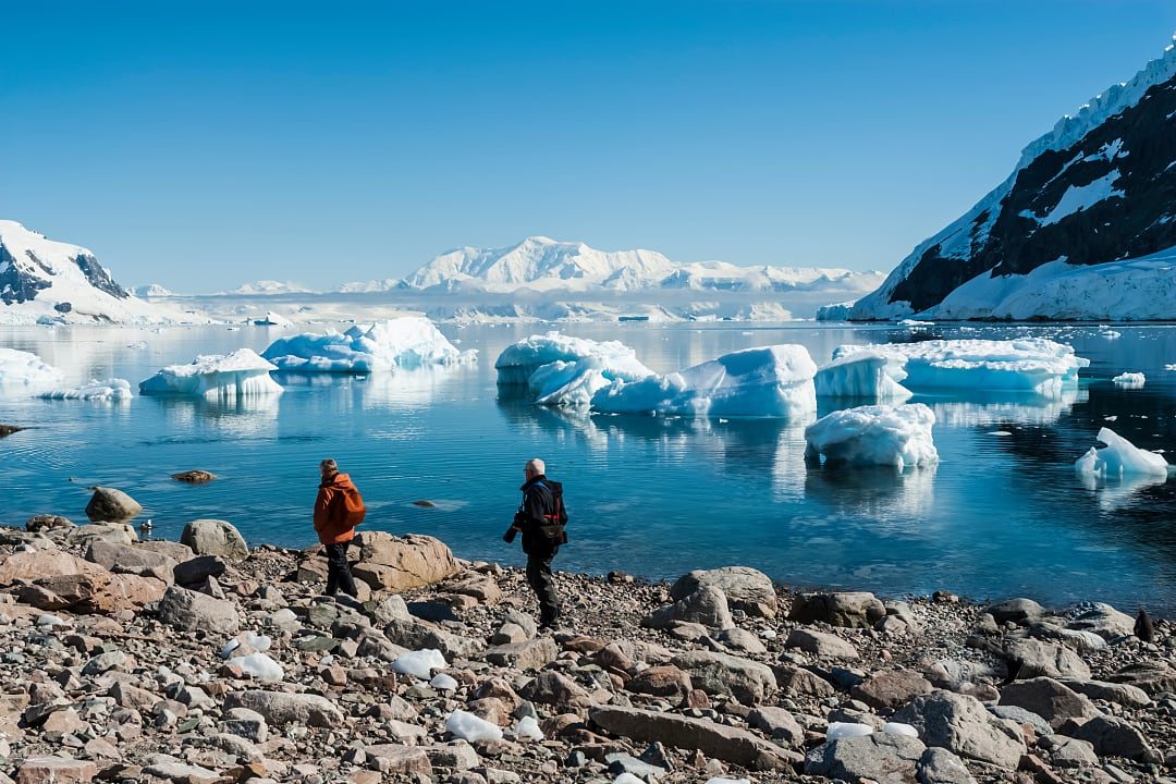 Senior couple at Neko Harbor in Antarctica
