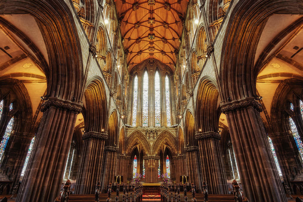 Gothic interior of Glasgow Cathedral with stained glass windows
