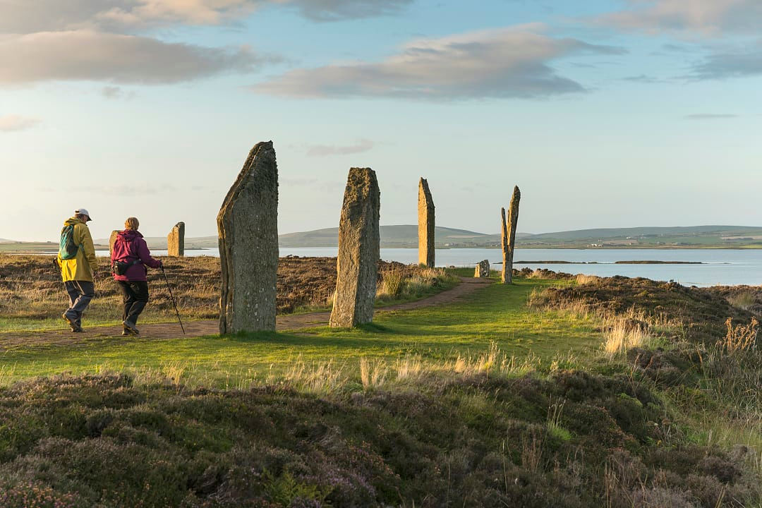 Senior couple hiking at the Ring of Brodger in Orkeny, Scotland