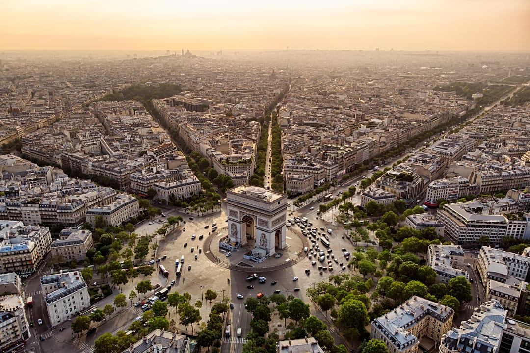 The Arc de Triomphe stands at Paris’ bustling central intersection.