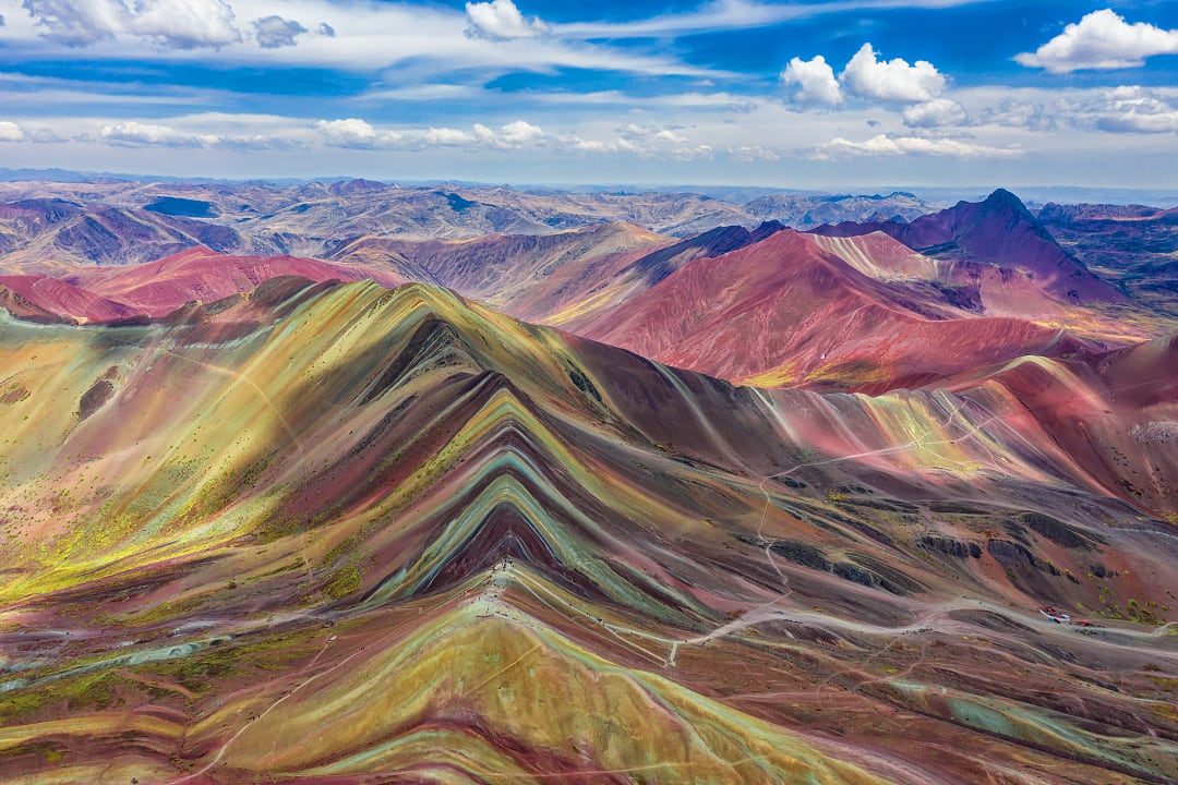 Stunning aerial view of Rainbow Mountain (Vinicunca), Peru, showcasing vibrant multicolored peak