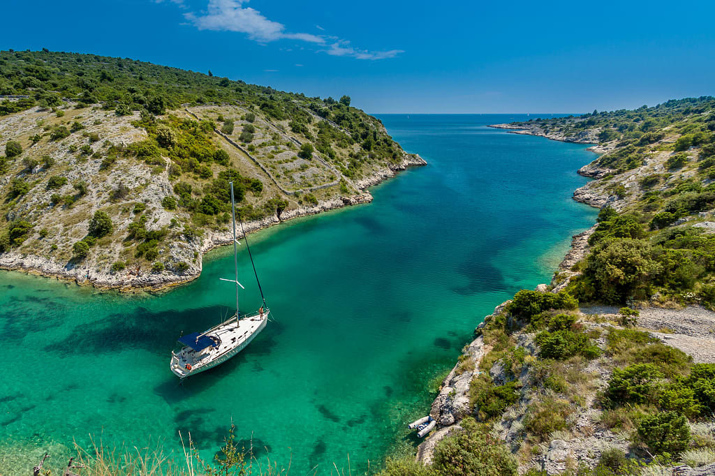 Sailboat moored along the coastline of Trogir, Croatia