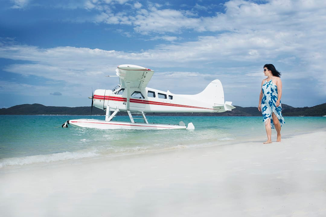A private seaplane arrival at sunrise on Whitehaven Beach to experience the sands in their most pristine state.