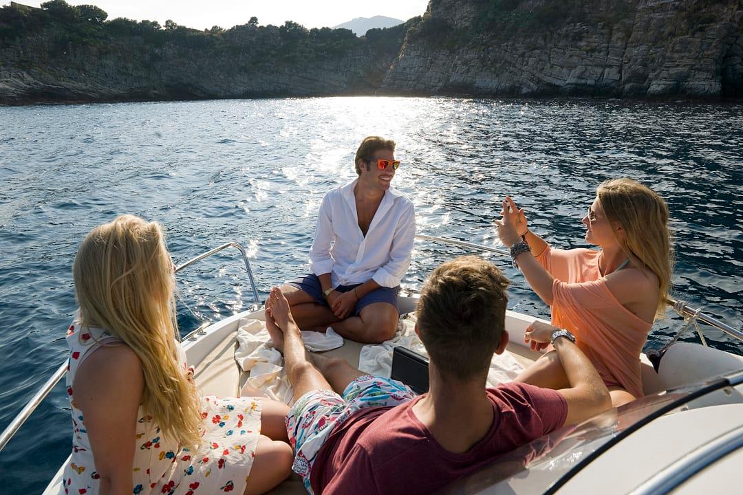 Friends on boat ride on the Mediterranean sea 