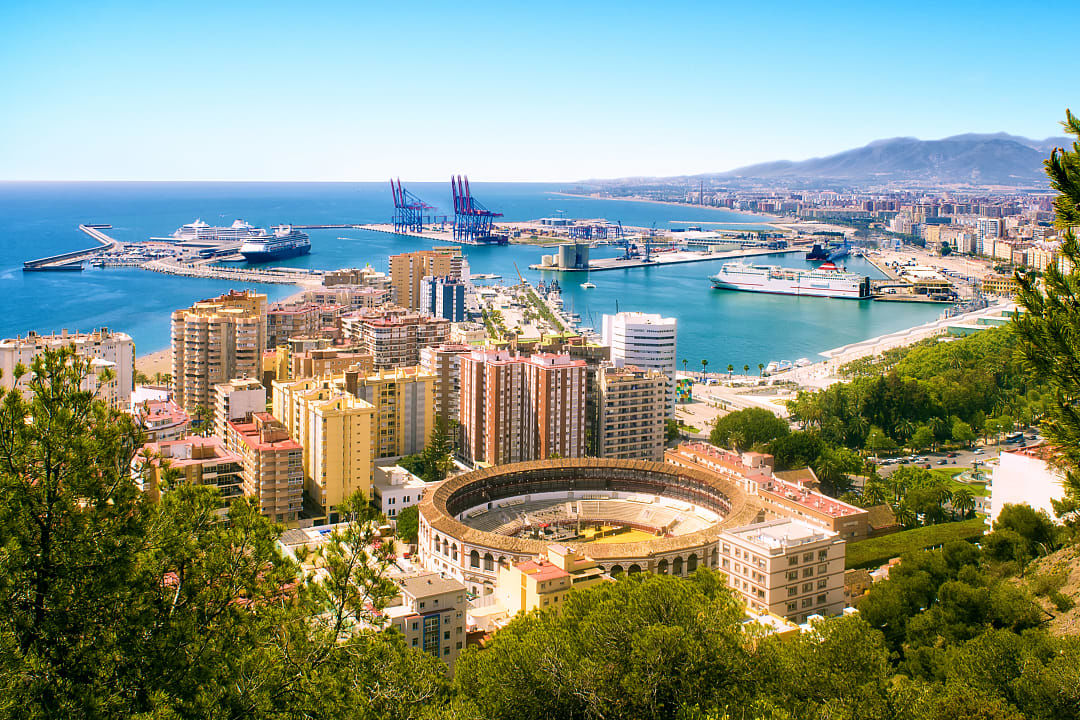 View of Malaga Bullring and Harbor in Spain.