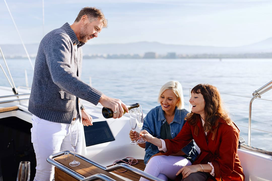 Friends enjoy a private yacht in Greece