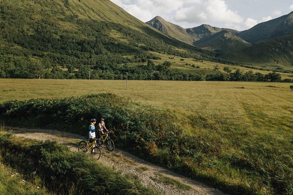 Couple biking in the Scottish Highlands