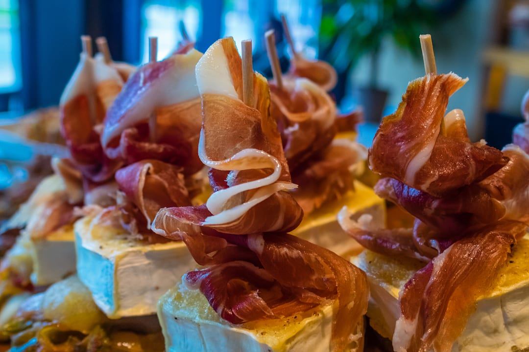 Traditional Basque Pintxos, made with ham and cheese.