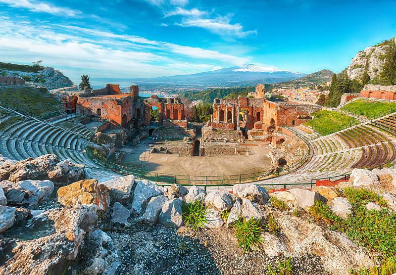 Ruins of an ancient Greek theater. View of Mount Etna. Tarmina, Sicily
