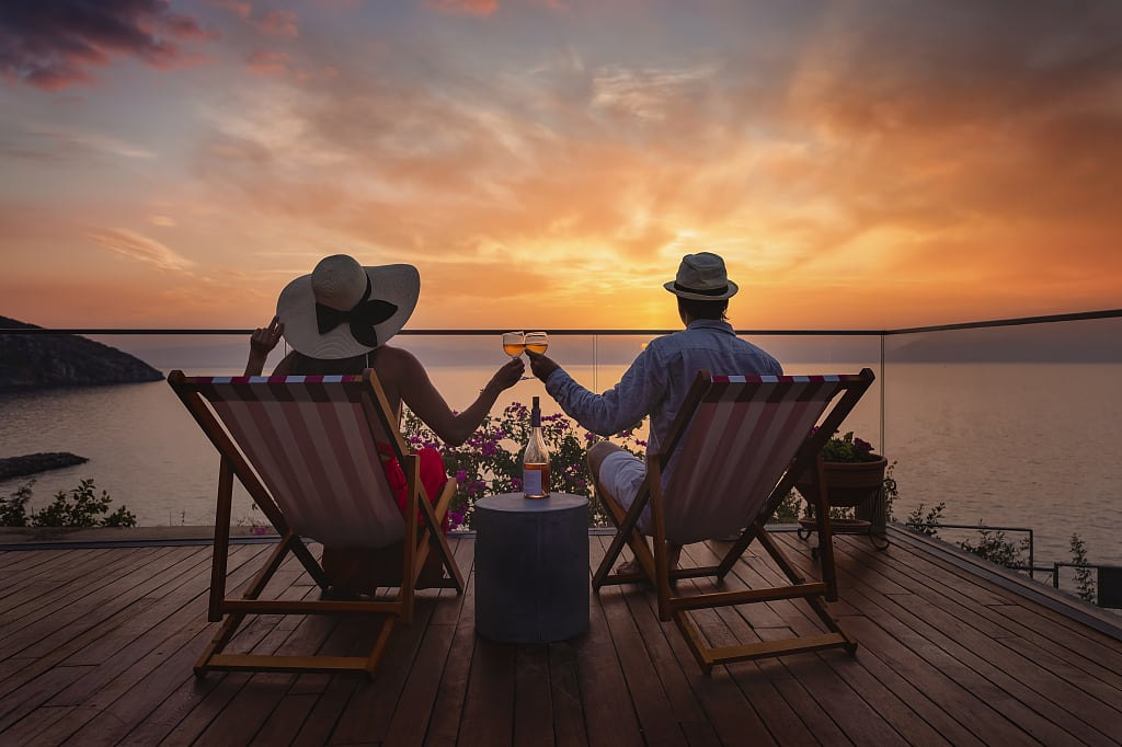 Couple enjoying the view at sunset in Greece