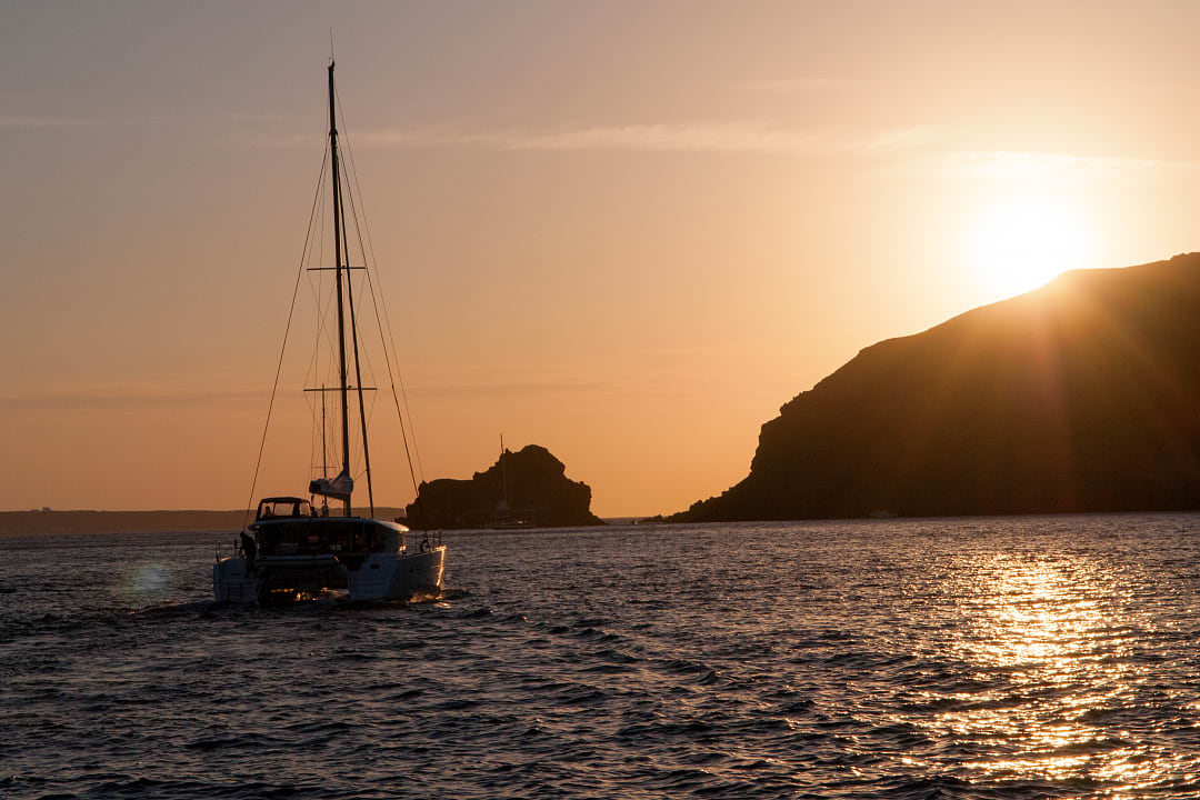 Sunset catamaran cruise in Santorini, Greece