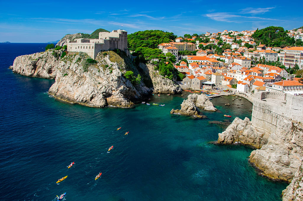 Kayakers in around the city wall in Dubrovnik, Croatia