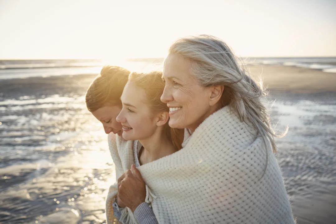 een and grandparent share comfort and dignity at sunset