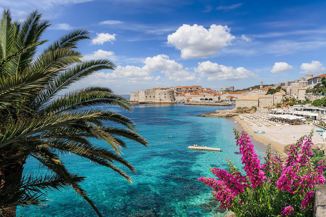 Banje Beach offers stunning Dubrovnik views and crystal-clear Adriatic waters. 