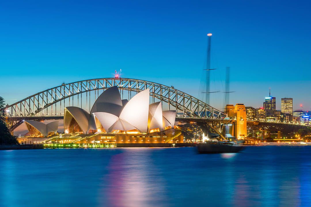 View of the Sydney Harbor Bridge during a night cruise, Australia.