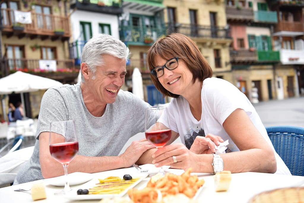 Senior couple dining outside in Spain