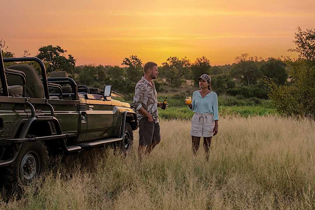 Couple enjoying a sunset safari in the Kruger National Park.
