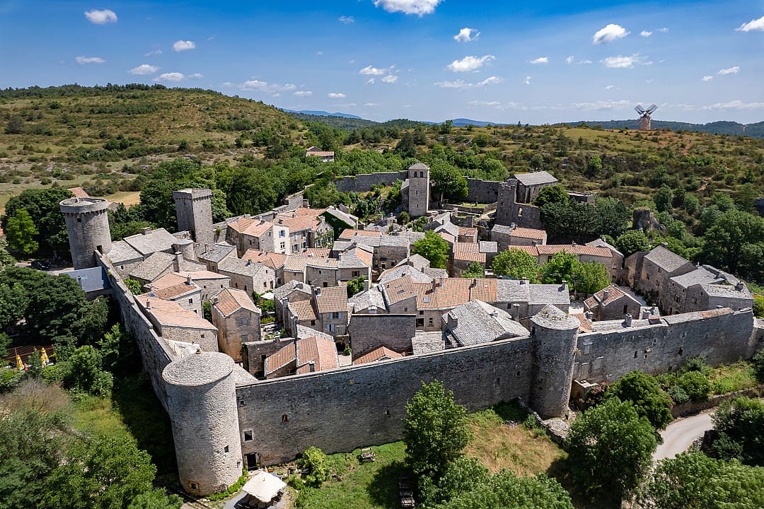 Aerial view of the fortified medieval village of La Couvertoirade in Aveyron, France, with stone walls