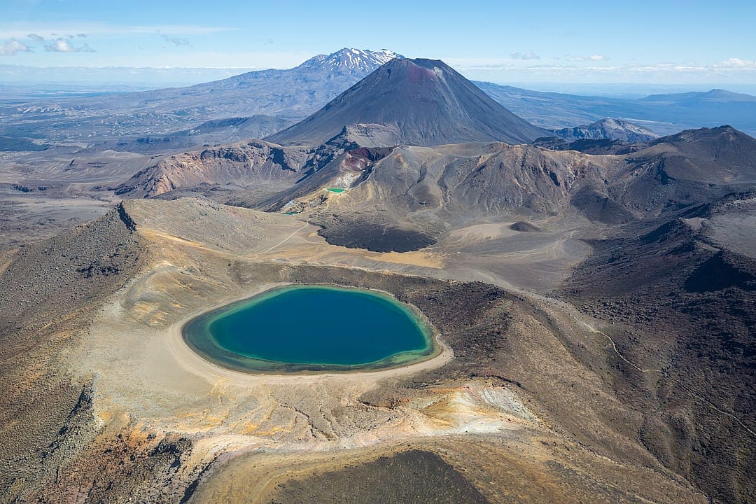 View of lake with Mount Ngauruoe and Tongariro and Mount Ruapehu on the Tongariro Northern Circuit