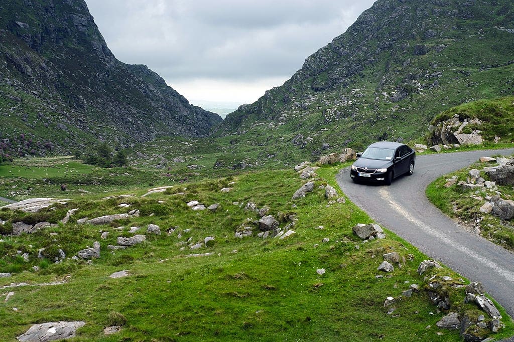 Car driving through Black Valley in Killarney National Park, Ireland