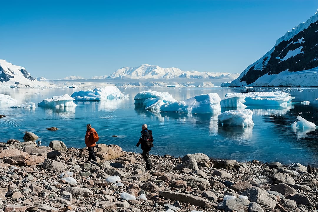 Senior couple at Neko Harbor in Antarctica